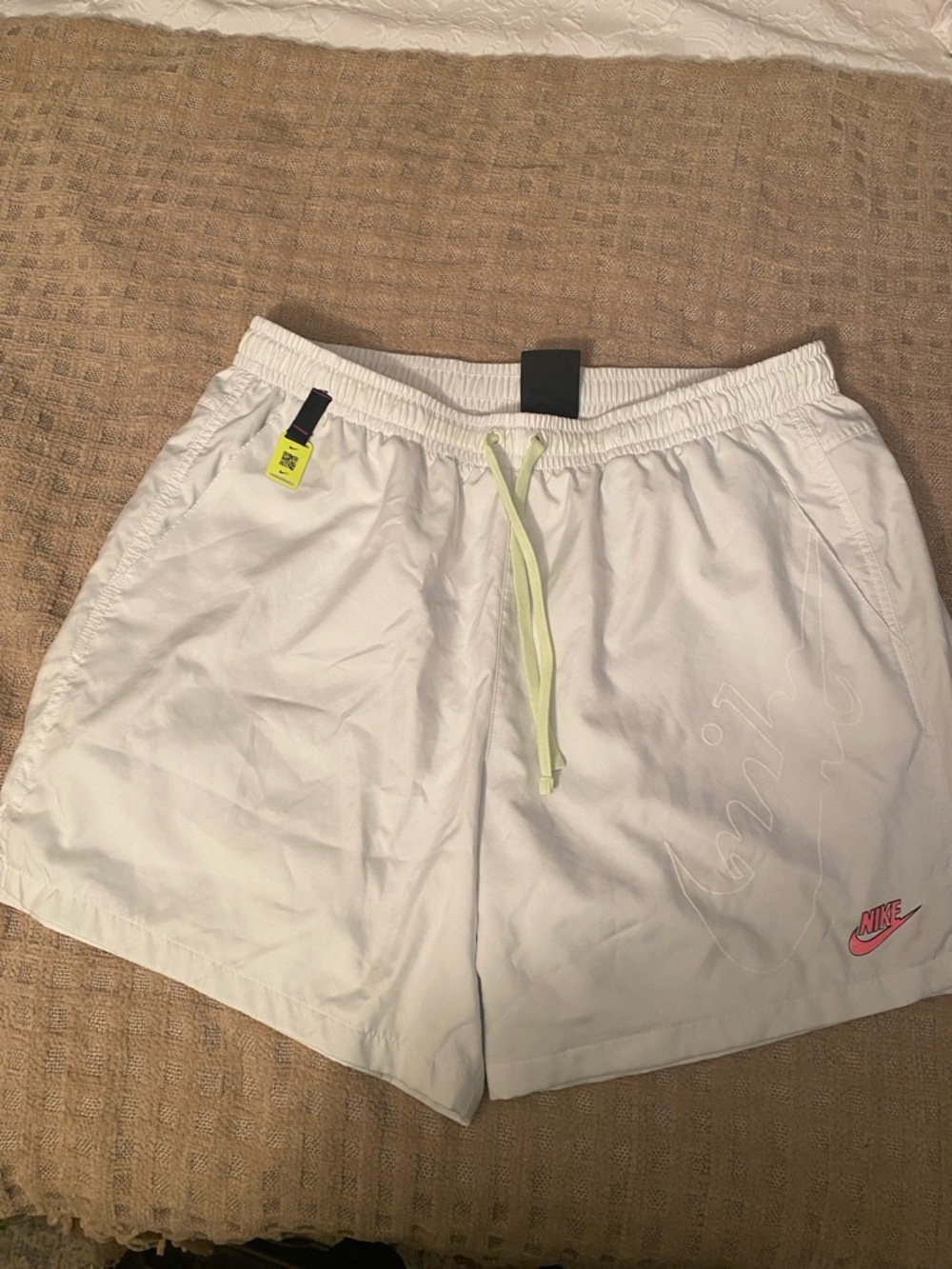 Nike White Athletic Shorts with Neon Yellow Drawstring and Pink Swoosh